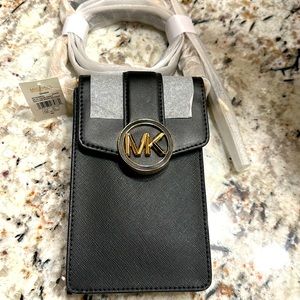 Brand new with tags Michael Kors  “Carmen” phone wallet.